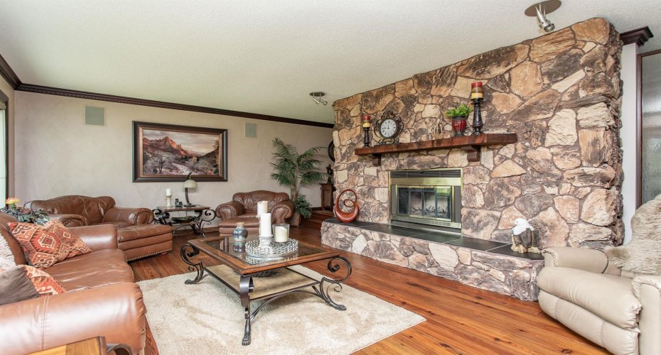 With custom stone masonry wood burning fireplace