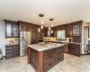 Granite counters, cherrywood cabinets, travertine backsplash