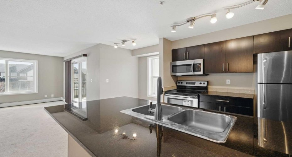 Upgraded granite countertops and newer stainless steel appliances