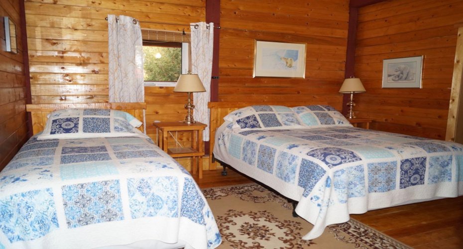 Main floor bedroom in lodge with ensuite