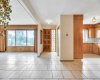 Front Door with Spacious entry between the Kitchen & Living Room.