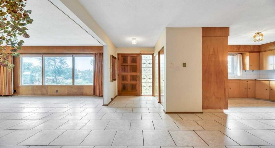 Front Door with Spacious entry between the Kitchen & Living Room.