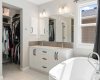 Soaker tub view to walk-in closet