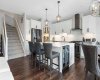 Gorgeous gourmet kitchen; stairs to upper floor