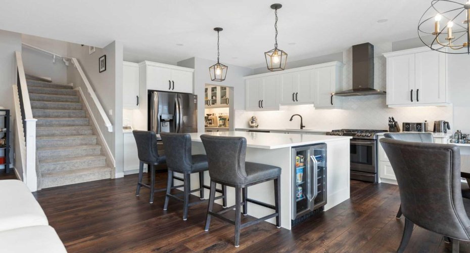Gorgeous gourmet kitchen; stairs to upper floor