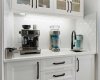 Custom butler's pantry with prep sink and additional cabinets and soft-close drawers
