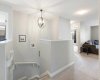 Top of stairs with view to comfy family room