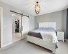 Spacious primary bedroom is a private retreat featuring a 5-piece luxury ensuite