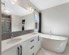 Dim the lights, light a candle and de-stress in this deep soaker tub.  Just make sure to close the curtains before getting out onto the heated tile floor:)