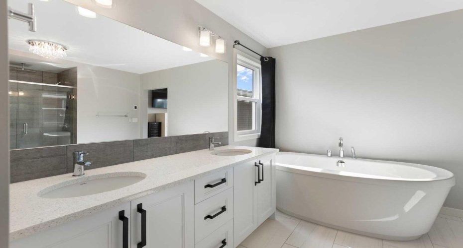 Dim the lights, light a candle and de-stress in this deep soaker tub.  Just make sure to close the curtains before getting out onto the heated tile floor:)