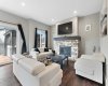 The living room centers around the stylish natural gas fireplace