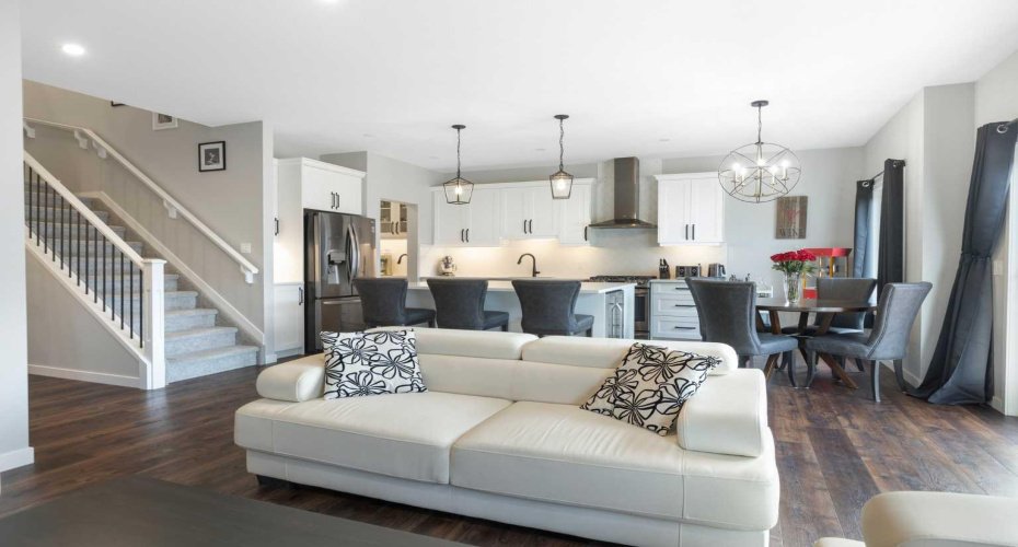 View from living room to the gorgeous gourmet kitchen & dining room