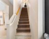 Stairways at entry & behind reception area