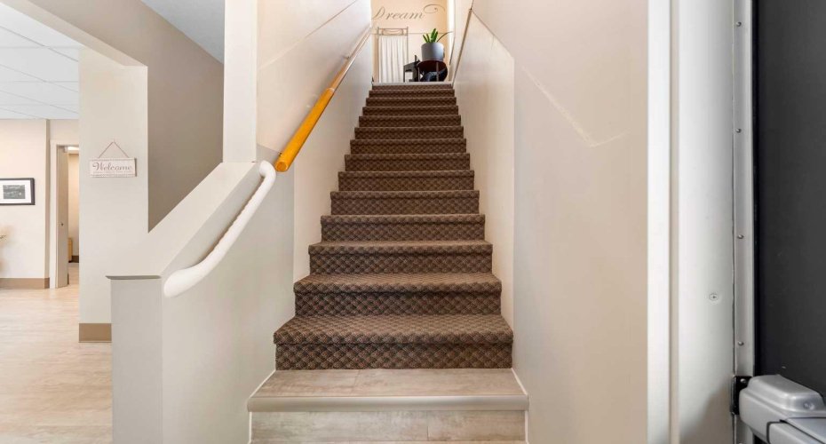 Stairways at entry & behind reception area
