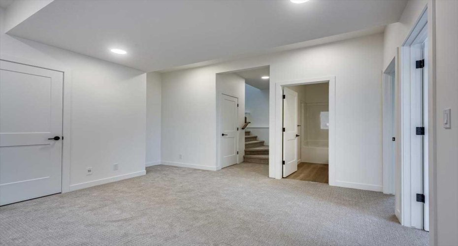family room view to bath & stairs