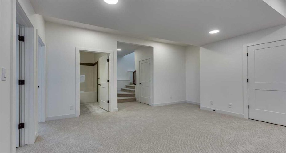family room view towards stairwell & bath
