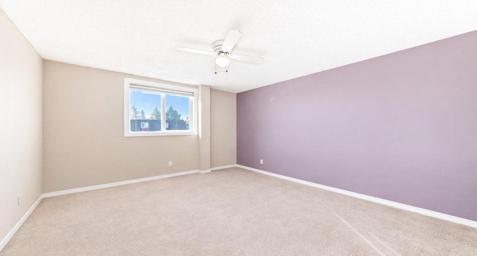 This image has been digitally cleared of furniture and decor to best illustrate layout and space.  This is the spacious primary bedroom.