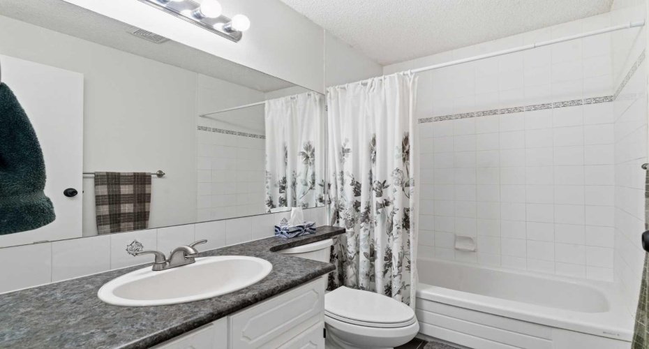 91 Deerfield Drive, Calgary, Alberta T2J 6T9, 3 Bedrooms Bedrooms, ,2 BathroomsBathrooms,Residential,For Sale,Deerfield,A2263400