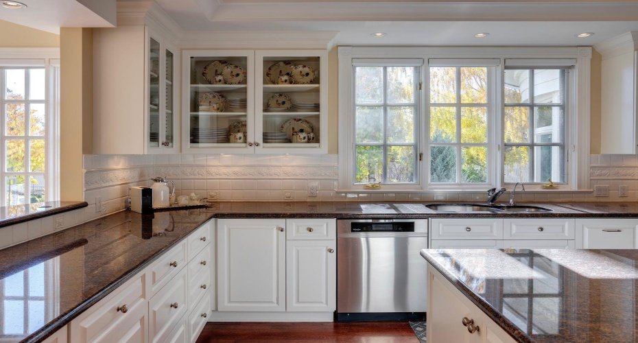 Glass cabinetry and ample counterspace