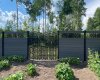 Gate opens to breezeway in the back & walking trail