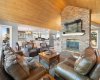 Grand stone fireplace anchoring the room