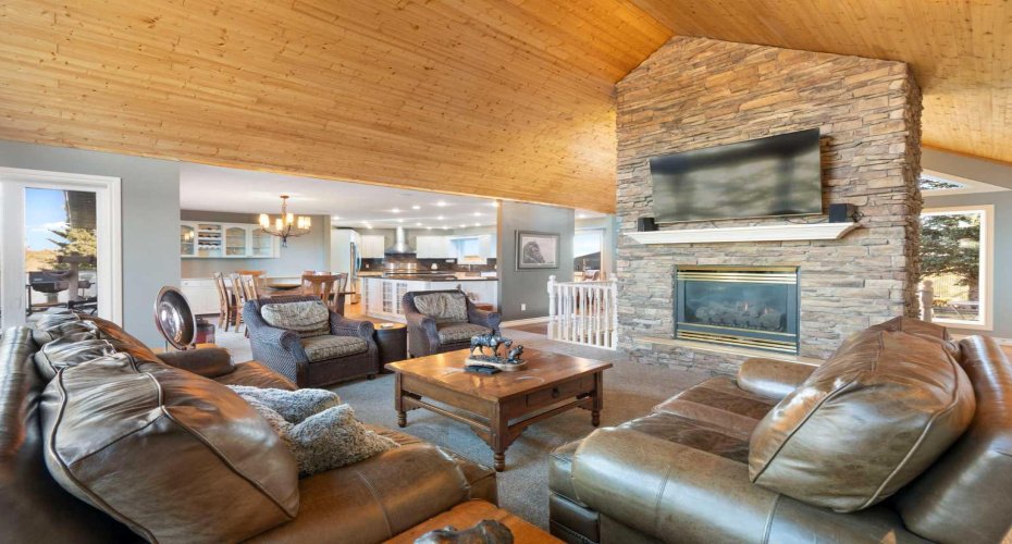 Grand stone fireplace anchoring the room