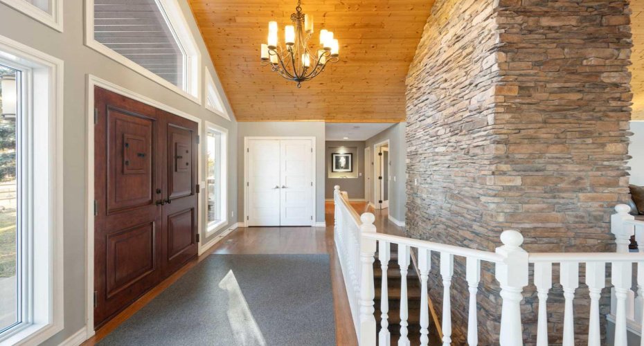 Foyer facing wing with primary bedroom and office