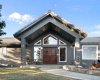 Front entrance with solid teak doors overlooking facility