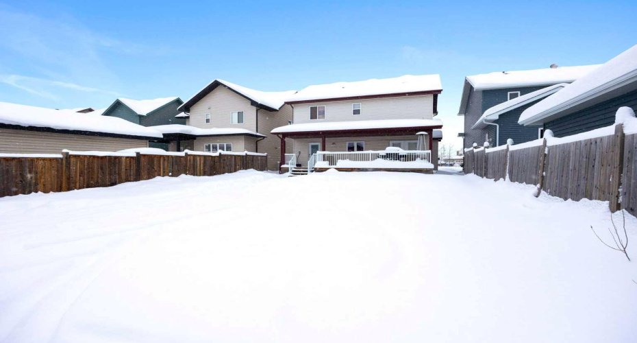 View from alley way of house with deck