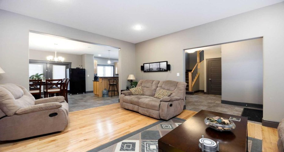 Spacious living room with view of dining room