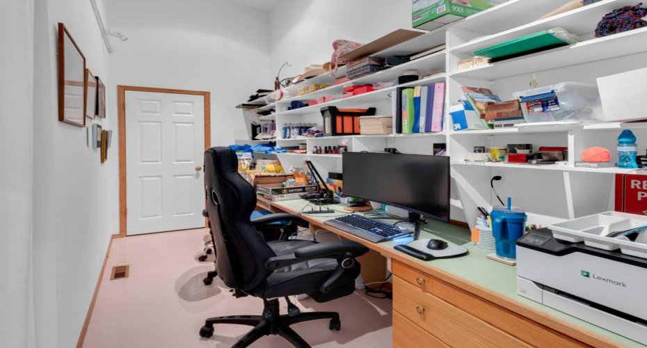 Main floor office/den with built in shelves