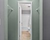 Primary Walk-Through Closet Leading to Bathroom