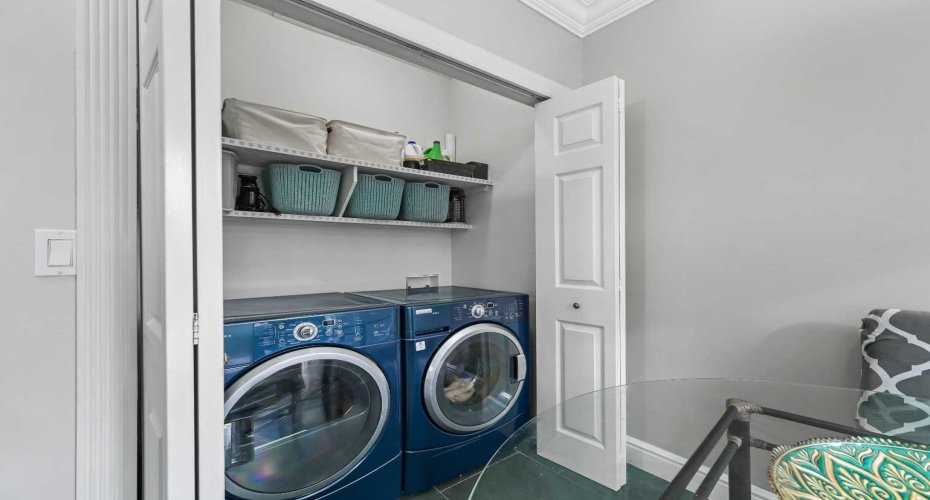 Main Floor Laundry tucked away in its own closet.