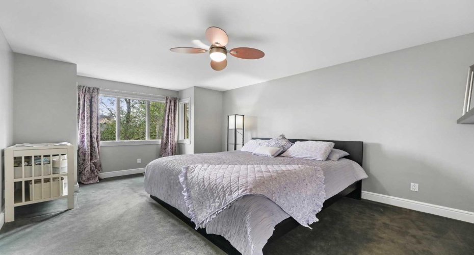 Large Primary Bedroom. Downtown View from the Large Windows.  ***FEB 2026!! MOST RECENT UPGRADE!! THE ENTIRE UPPER LEVEL CARPETING REPLACED WITH NEW LUXURY 60 oz HIGH END CARPETING (New photos coming soon).