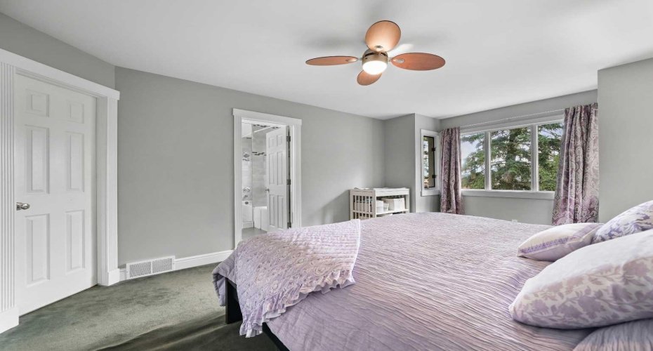 Another View of the Primary Bedroom with Corner Walk-In-Closet! *** FEB 2026!! MOST RECENT UPGRADE!! THE ENTIRE UPPER LEVEL CARPETING REPLACED WITH NEW LUXURY HIGH END 60 oz CARPETING (New photos coming soon).***