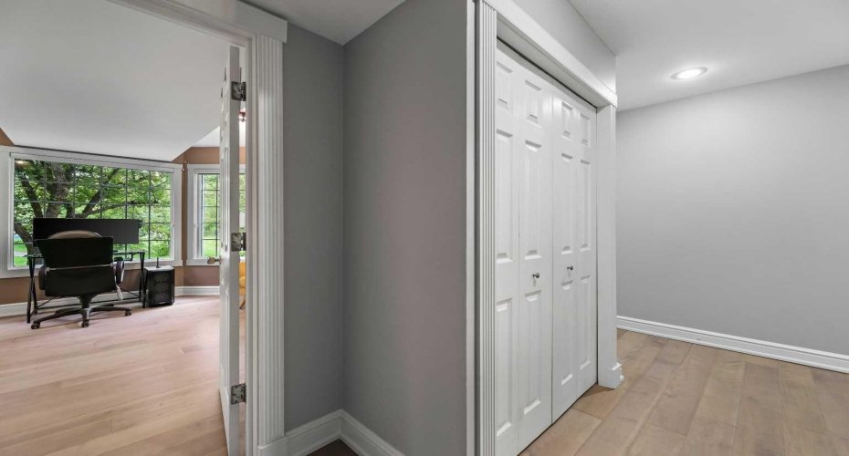 Ground Floor. This 3rd Bedroom currently services as a very inviting and fun filled Media Room. Would make a great office, library , or even an excercise room.