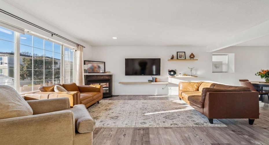 Inviting Living Room with Lots of Natural Light and a Gas Fireplace