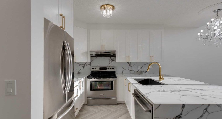 CUTOM KITCHEN W. MARBLE WATERFALL & GOLD ACCDENTS