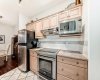 Bright, well-appointed kitchen with ample counter space and a thoughtful layout — ideal for everyday cooking and entertaining.