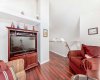 Versatile upstairs bonus room with abundant natural light, perfect for a home office or media space.