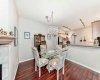 Inviting dining area accented by a cozy fireplace — a warm and welcoming space for meals and conversations.