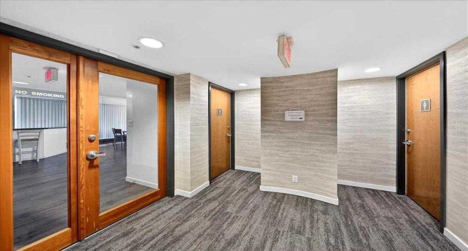 Main floor entrance to gym, bathrooms ahead and amenity room  left