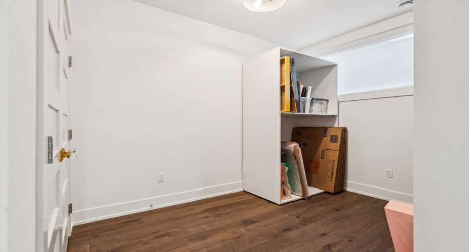 BEDROOM $4 WITH LARGE WINDOW.  STORAGE RACKS CAN BE REMOVED