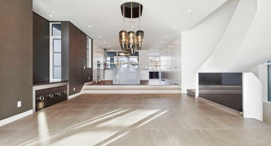 DINING ROOM WITH DESIGNER LIGHTING AND SERVING STATION-STORAGE TO THE SIDE