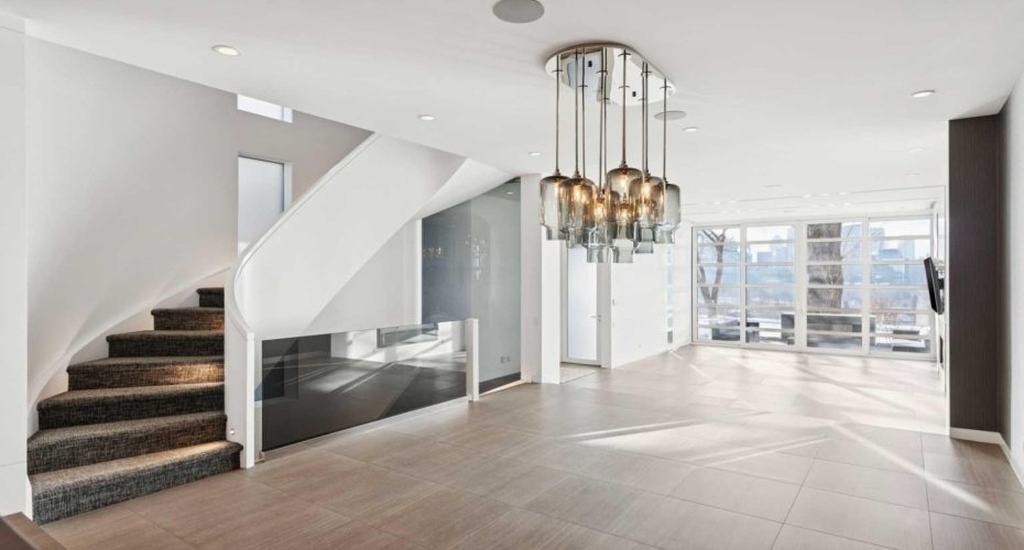 SCULPTURAL CUSTOM STAIRCASE CONNECTS ALL LEVELS