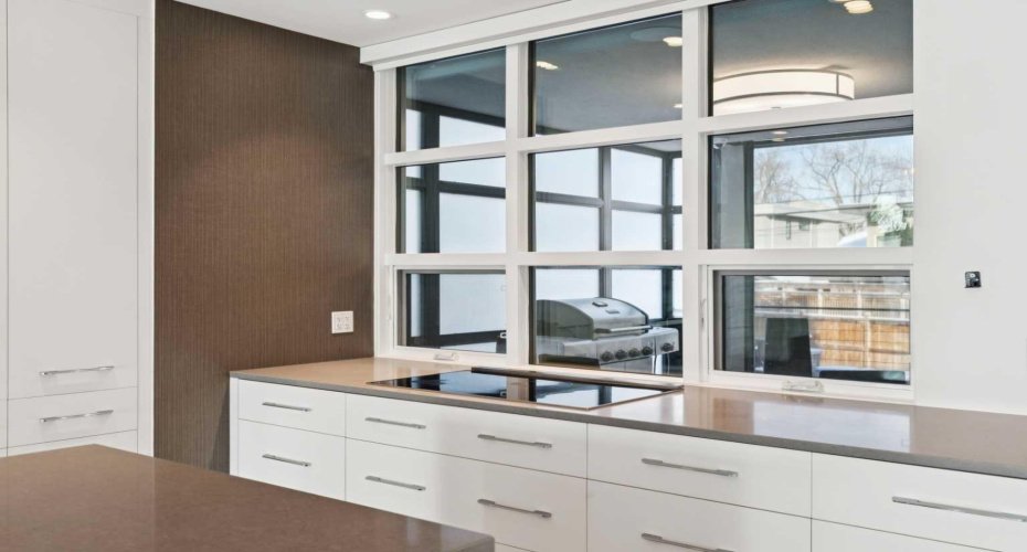 REAR OF THE KITCHEN LOOKS INTO THE 