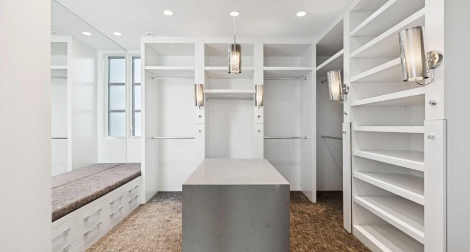 CUSTOM-DESIGNED WALK-IN CLOSET AND DRESSING ROOM.  LOTS OF DRAWERS.  ADDITIONAL BACK OF CLOSETS NOT SHOWN