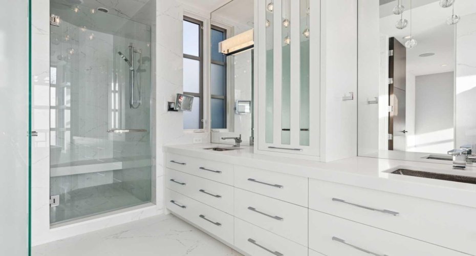 LARGE WALK-IN SHOWER WITH MULTIPLE HEADS AND BENCH.  DIFFUSED GLASS WATER CLOSET NOT SHOWN