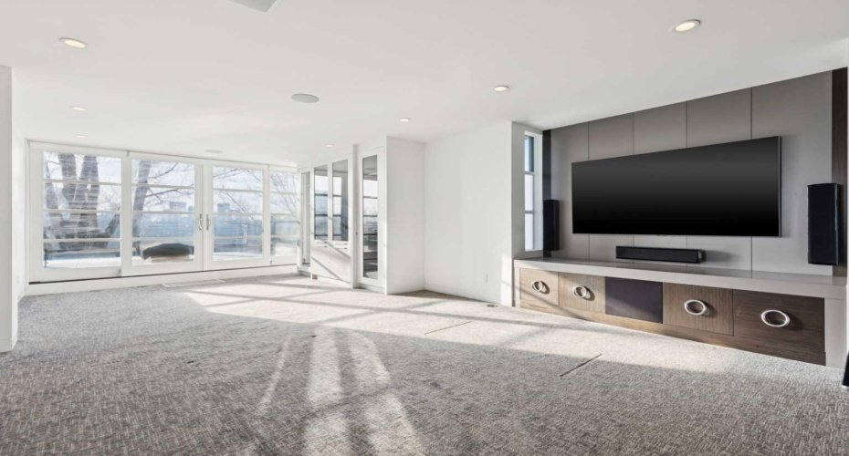 TOP FLOOR MEDIA ROOM AND LOUNGE WITH VIEWS.  THEATRE SYSTEM INCLUDED