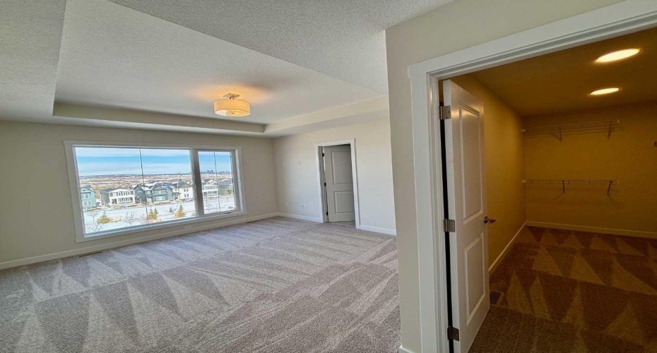 Photos are of property address Versant Rise SW, same Montay II floor plan as 695 Buffaloberry Manor. Photos are representative for layout only, colours and finishes may vary.